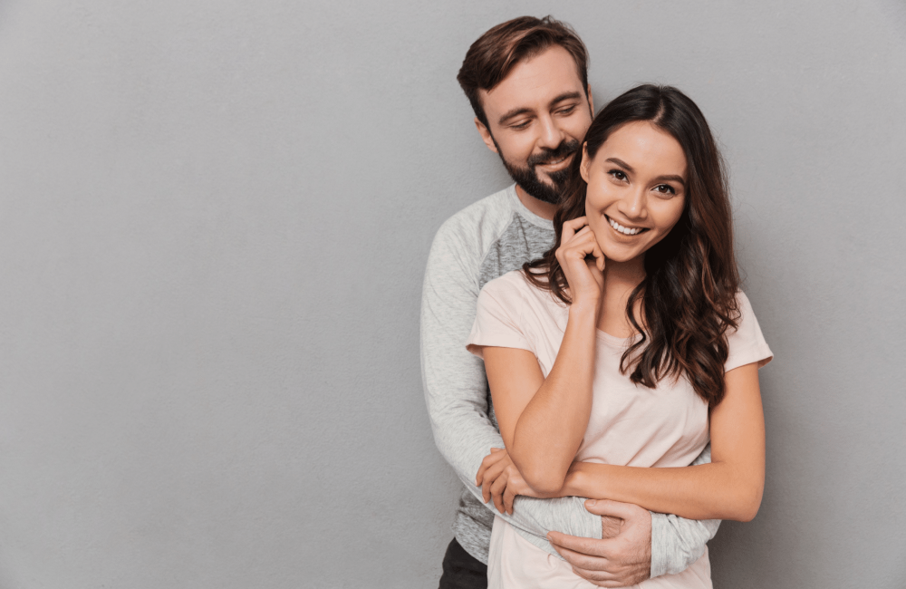 Couple hugging smiling Couple hugging smiling