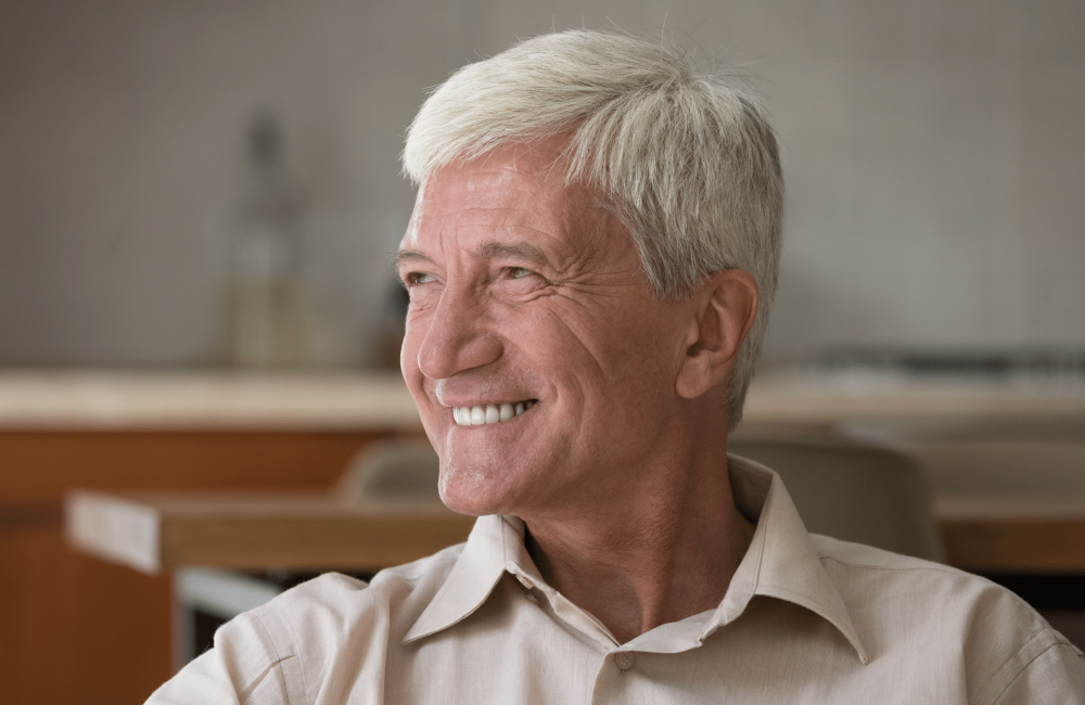 older man smiling implants