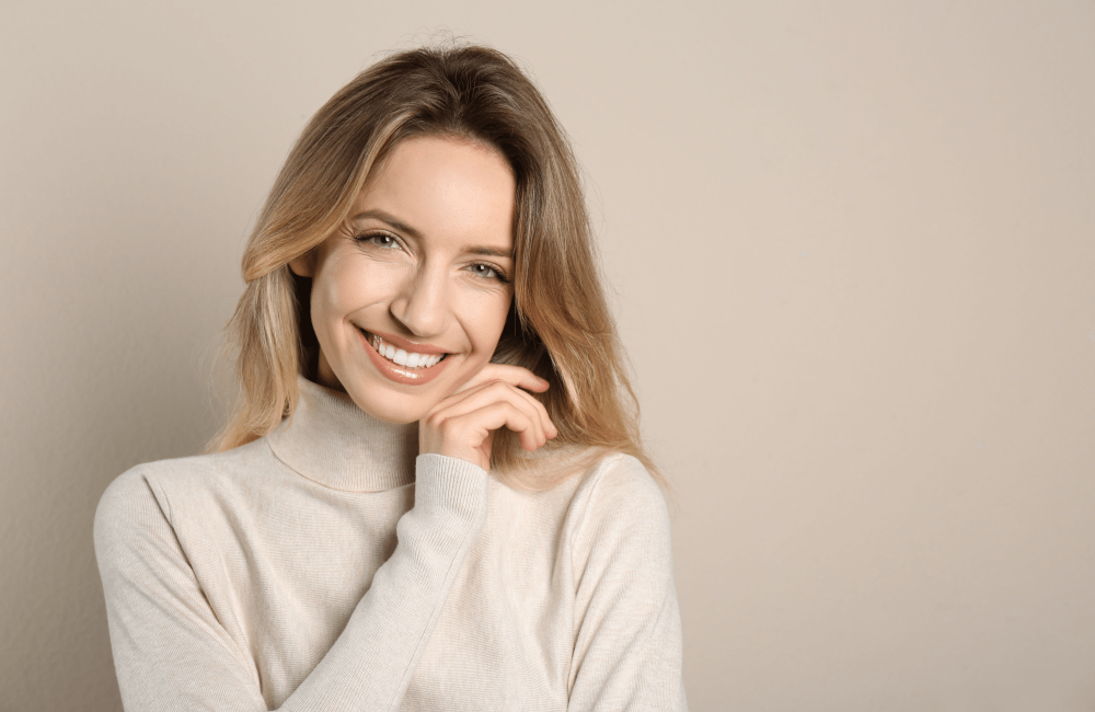woman smiling beige background woman smiling beige background